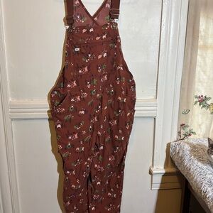 Duluth Trading Co Rust Floral Overalls with Chickens, Gnomes, and Bunnies.